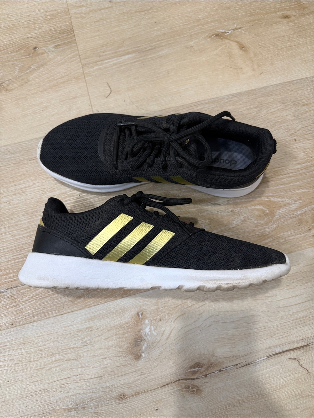 adidas Cloudfoam women’s Black Sneakers with Gold Stripes and white sole